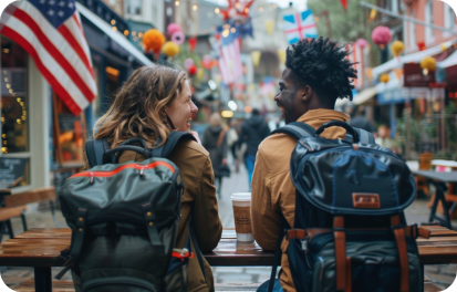 Two people sitting in a café discussing their immigration journey