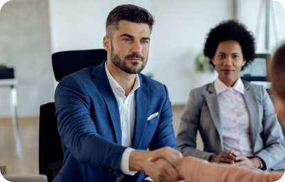 Businessman shaking hands representing employment-based visa services